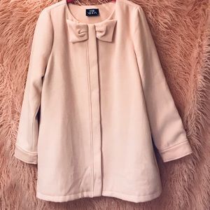 Beautiful new boutique pink coat with bow accent